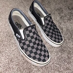 Women’s black/gray checkered slip ons